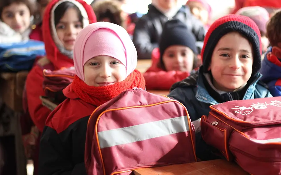 Schulkinder in Syrien | © UNICEF/Al-Issa Schutz für Kinder in Schulen: Lächelnde Kinder in einer Schule in Syrien